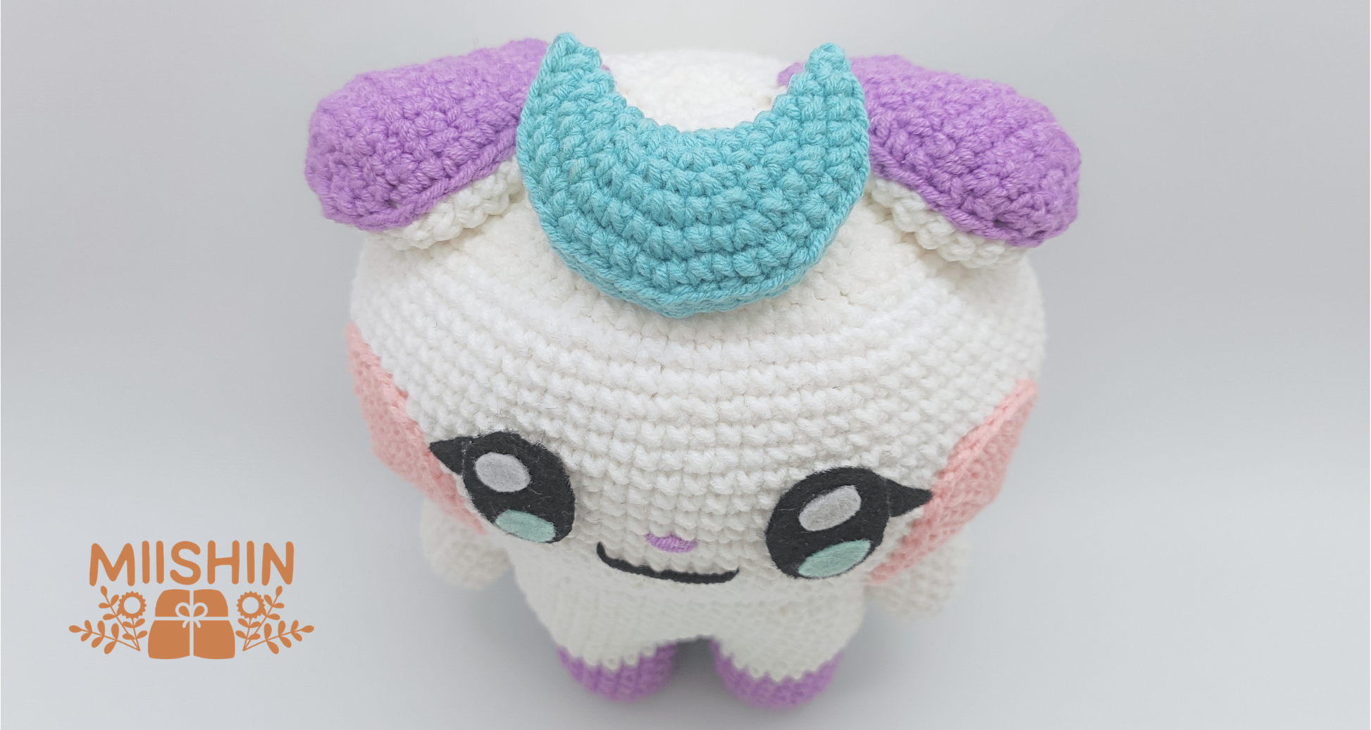 Handmade Jjongyo crochet plushie doll in white and purple yarn, handcrafted K-Pop amigurumi collectibles by Miishin. Top View.