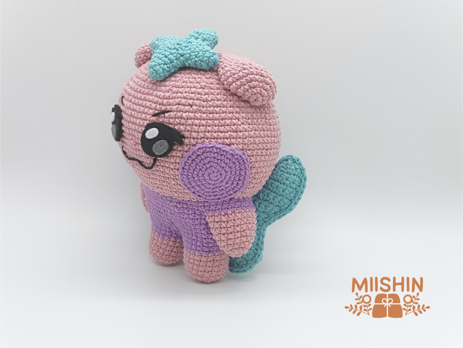 Side view of handmade Saniyo crochet plush
