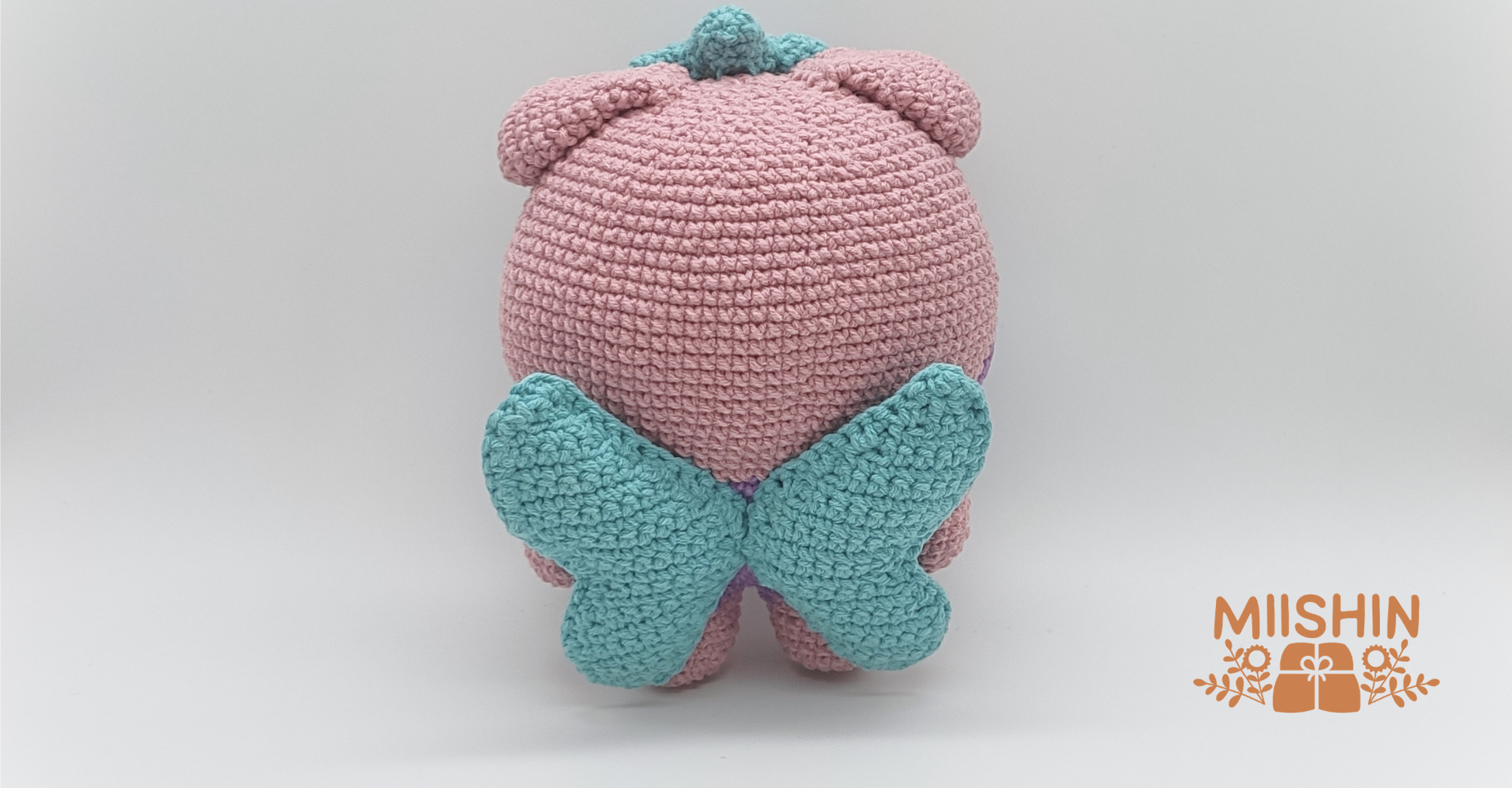 Back view of handmade Saniyo crochet plush
